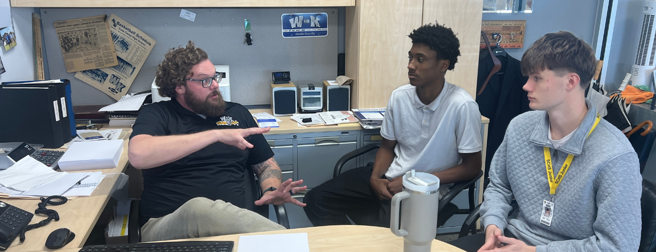 Two CAPS students learning about sales at W-K