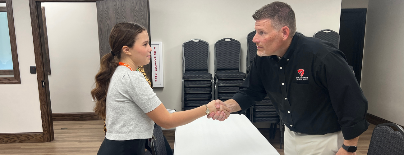 CAPS Student shaking hands with a professional