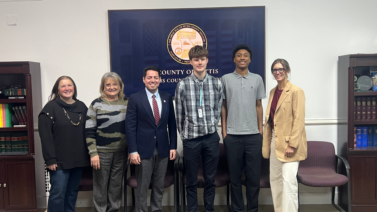 Two CAPS associates along with a Instructor at a meeting at the courthouse in sedalia Mo.